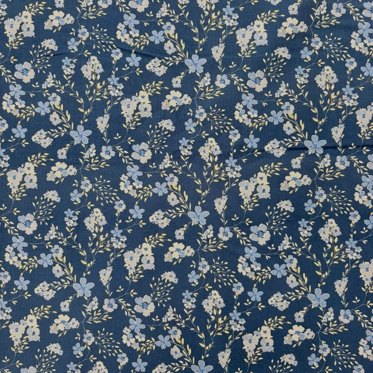 C858 Dainty Trailing Floral Needlecord Blue Fabric Swatch