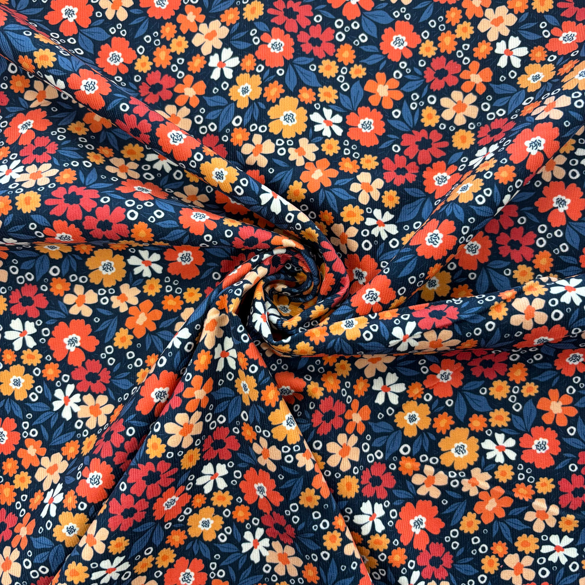 C859 Flower Power Needlecord Navy Coral Fabric Gathered