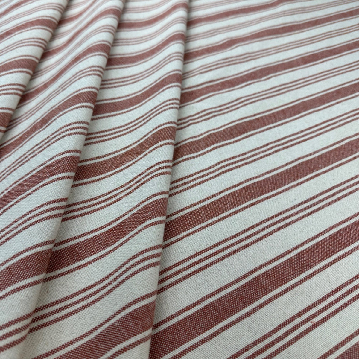 H364 Raphael Rustic Stripe Rust Fabric Folded