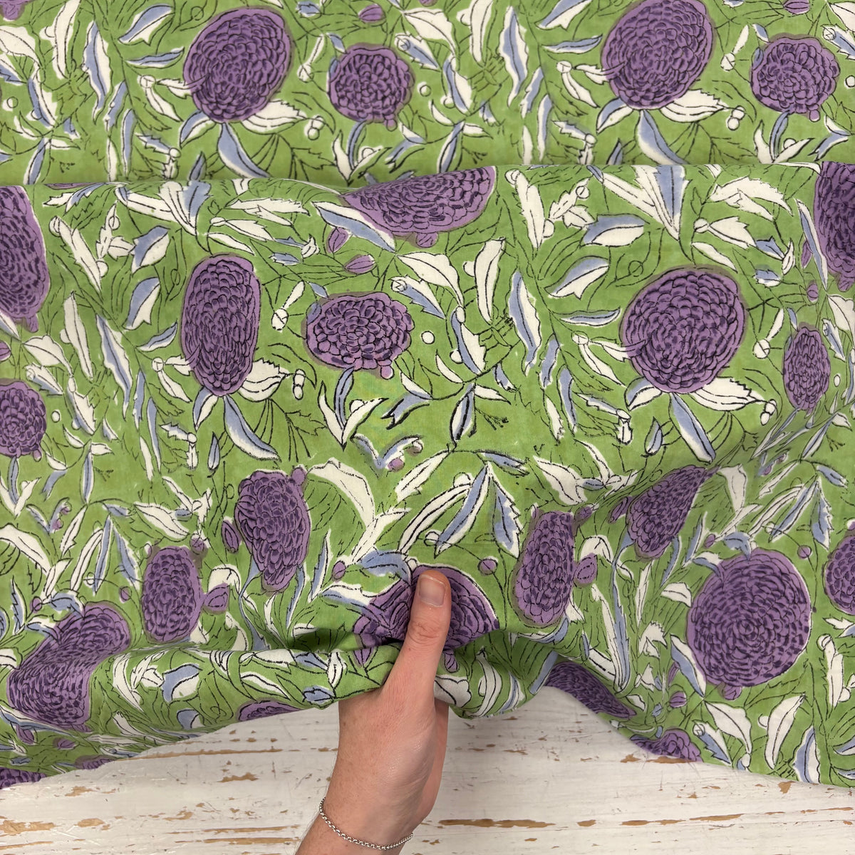 Hydrangea Floral Block Print Cotton Fabric, with hand for scale, lightweight soft cotton with a traditional handcrafted Indian floral pattern