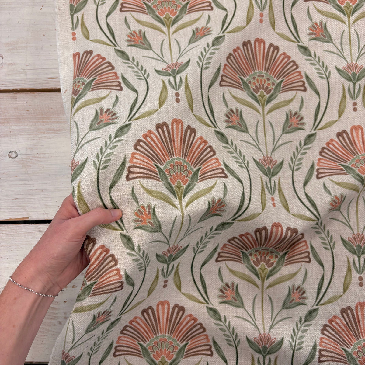 Prestigious Petunia Autumn Fabric With Hand For Scale
