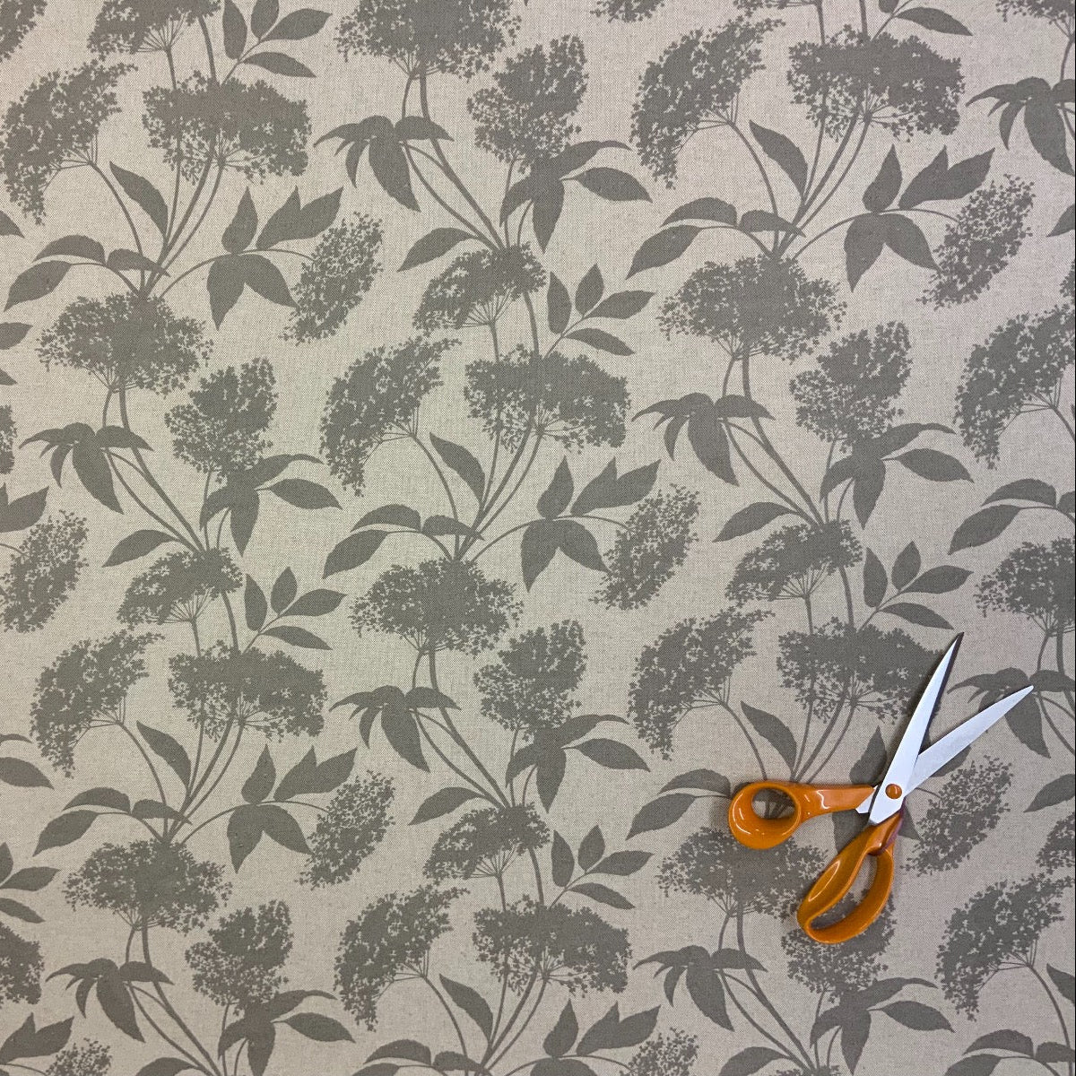 S187 Elderflower Oilcloth Taupe Fabric Scale