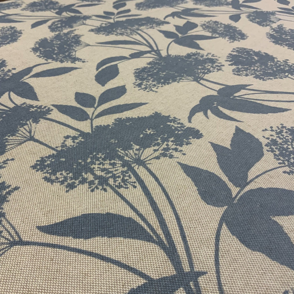 S188 Elderflower Oilcloth Natural Blue Fabric Close Up