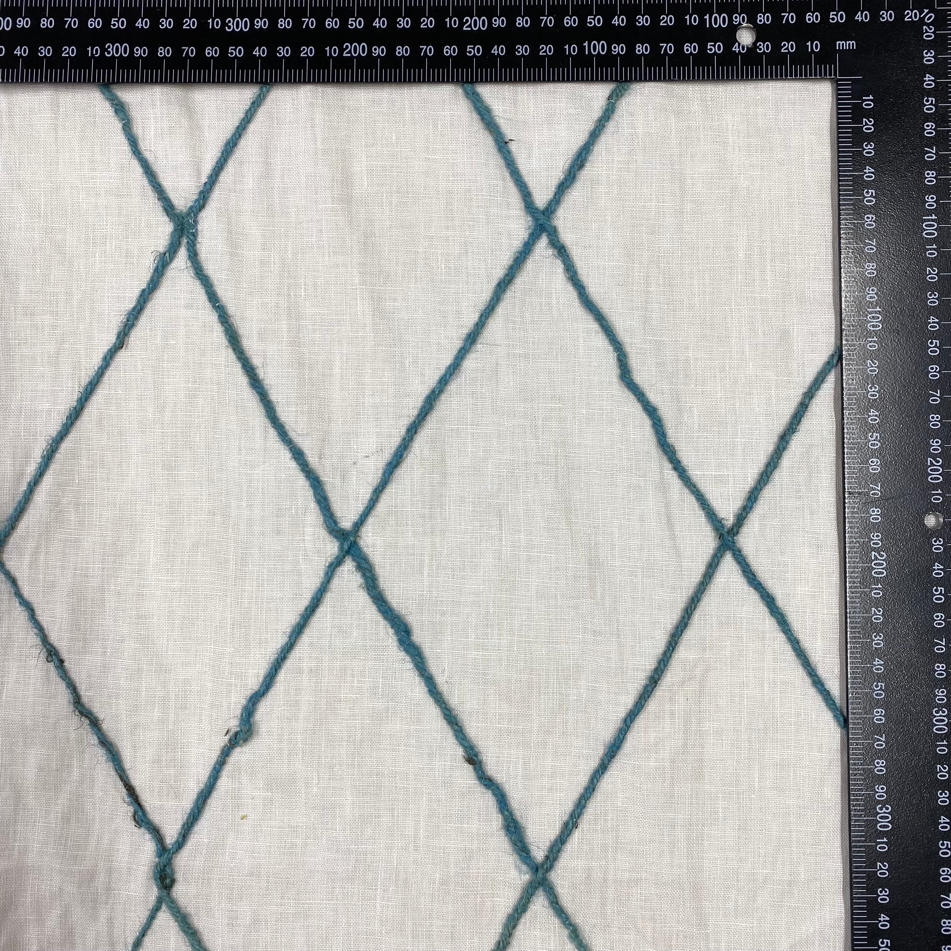 Tex Ex 2938 Embroidered Diamond Trellis Linen Denim With ruler for scale