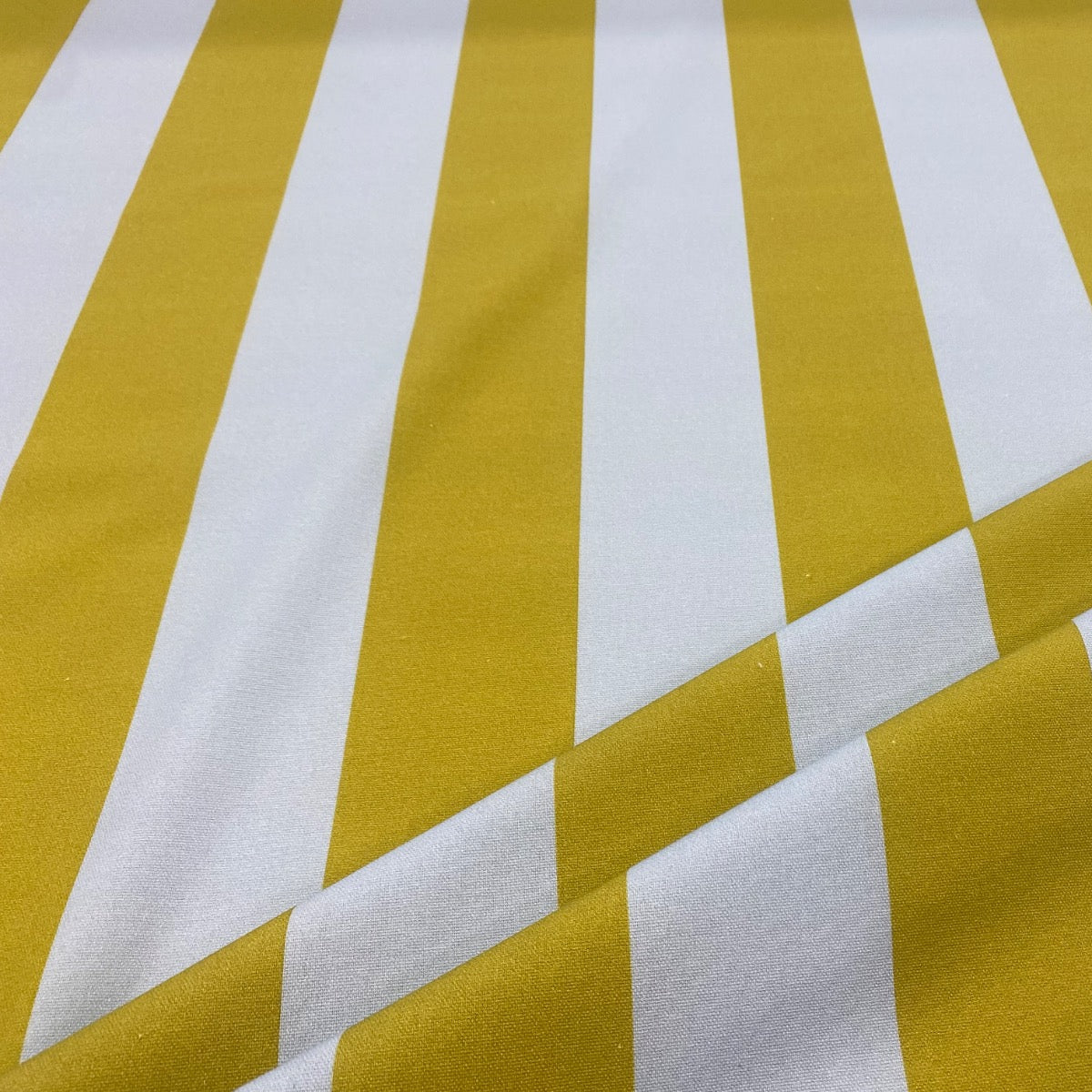 bold green and blue cotton stripe fabric folded