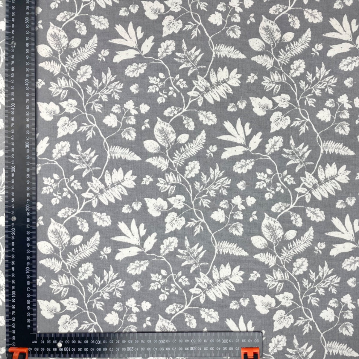 Clarke & Clarke floral print cotton curtain fabric grey background.