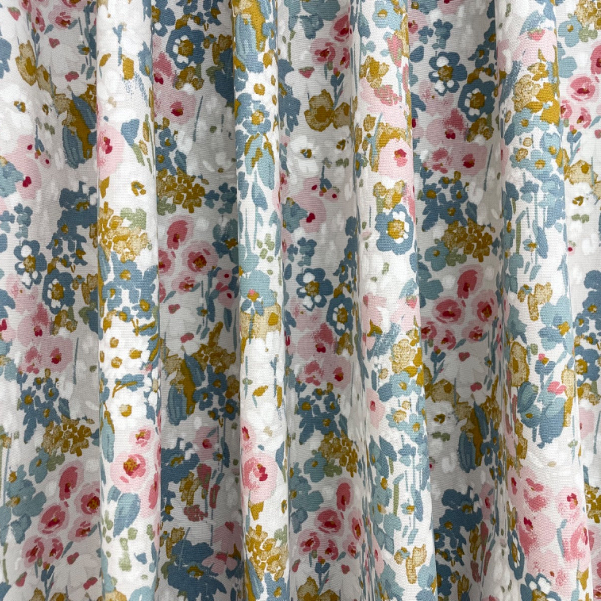 Floral patterned fabric with colorful flowers on a white background