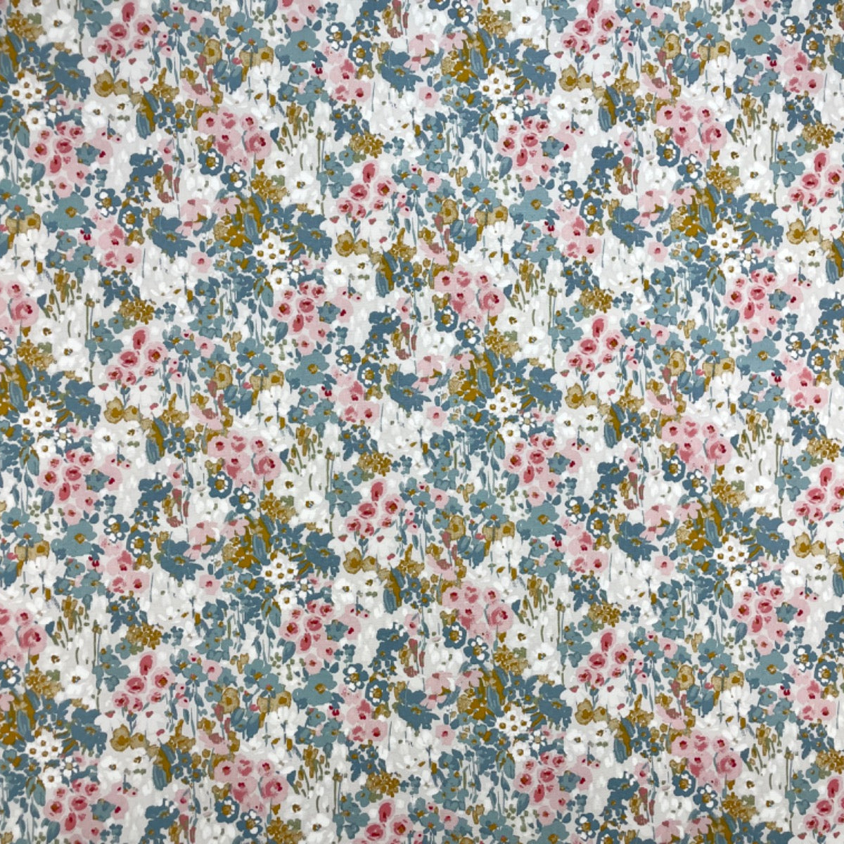 Floral patterned fabric with small flowers in various colors on a light background