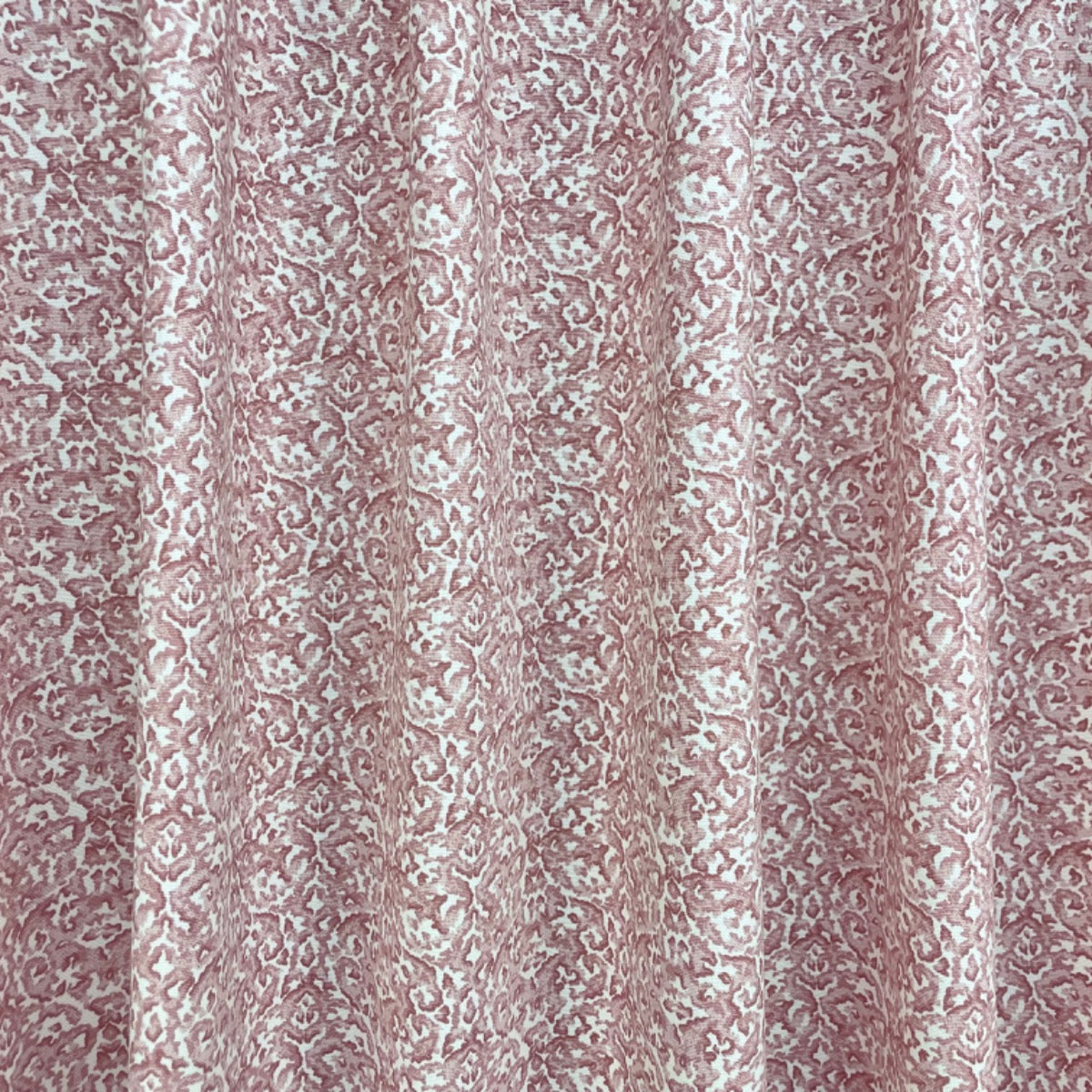 Clarke & Clarke Swinley Blush pink damask style cotton curtain fabric. Folded.