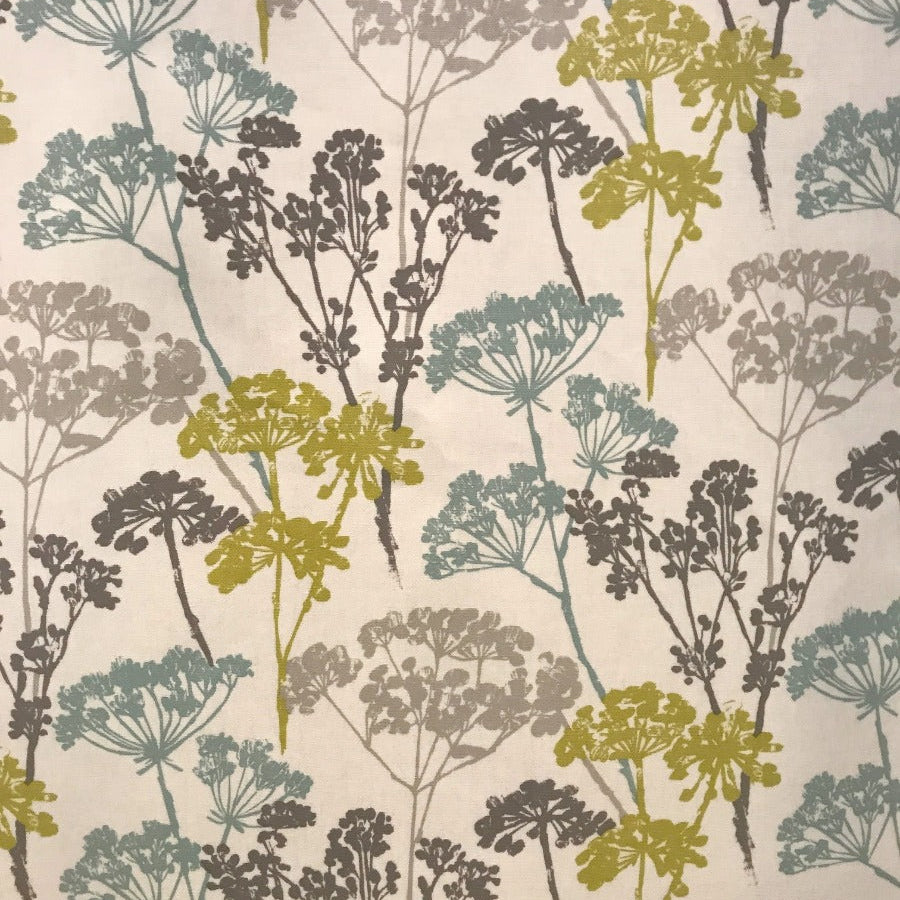 Floral patterned fabric with green, brown, and blue colors on a white background