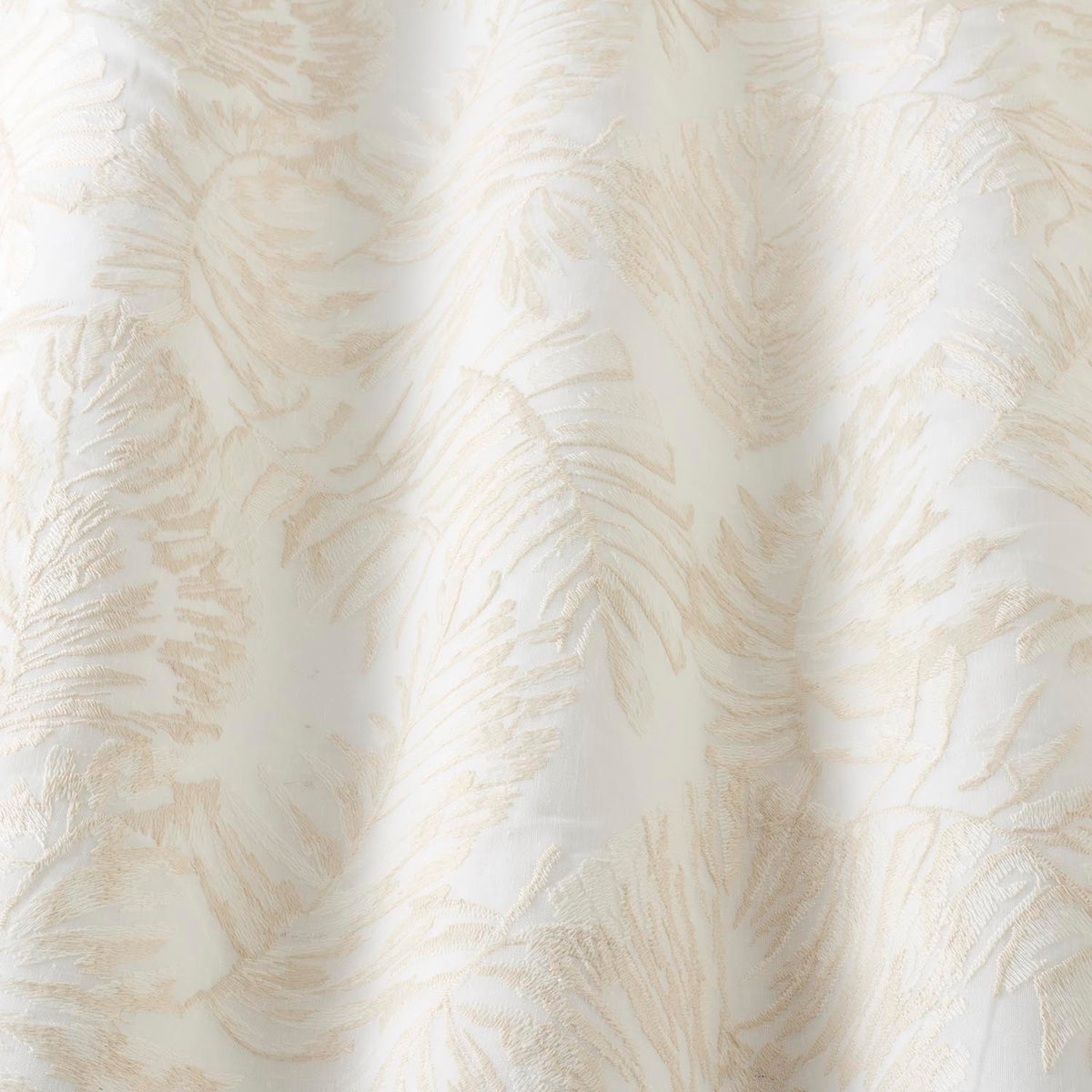 iLiv Calista Voile Ivory fabric gathered featuring a delicate tone on tone embroidered floral design on a soft ivory coloured voile.