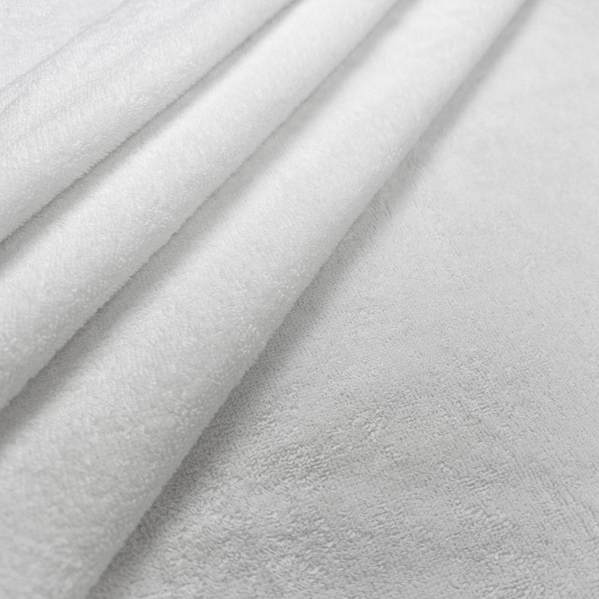 White cotton towelling fabric gathered