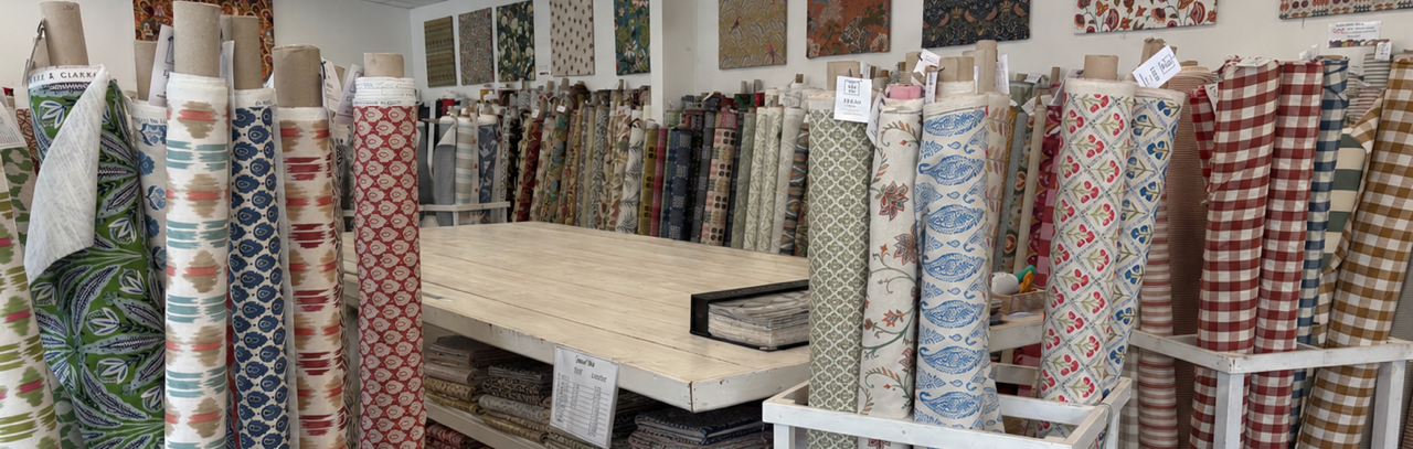 A selection of curtain fabrics including velvet, linen, floral and plain weaves from Textile Express, Oswestry