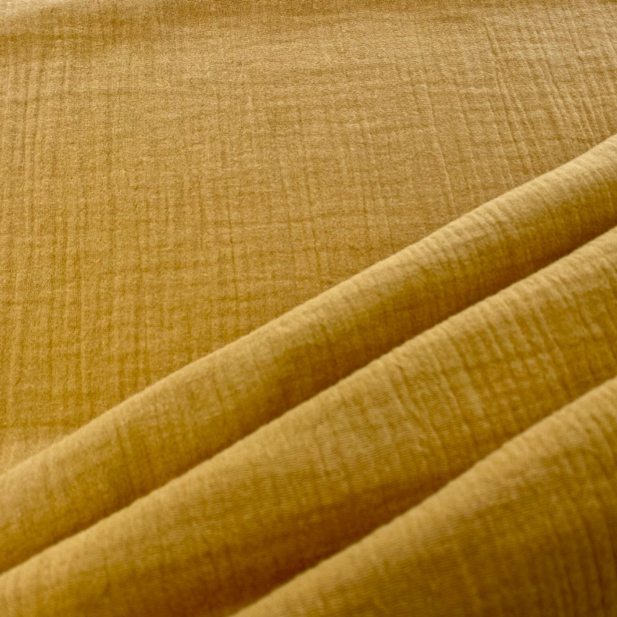 C337 Muslin Double Gauze Crinkle Gold/Mustard Fabric Folded