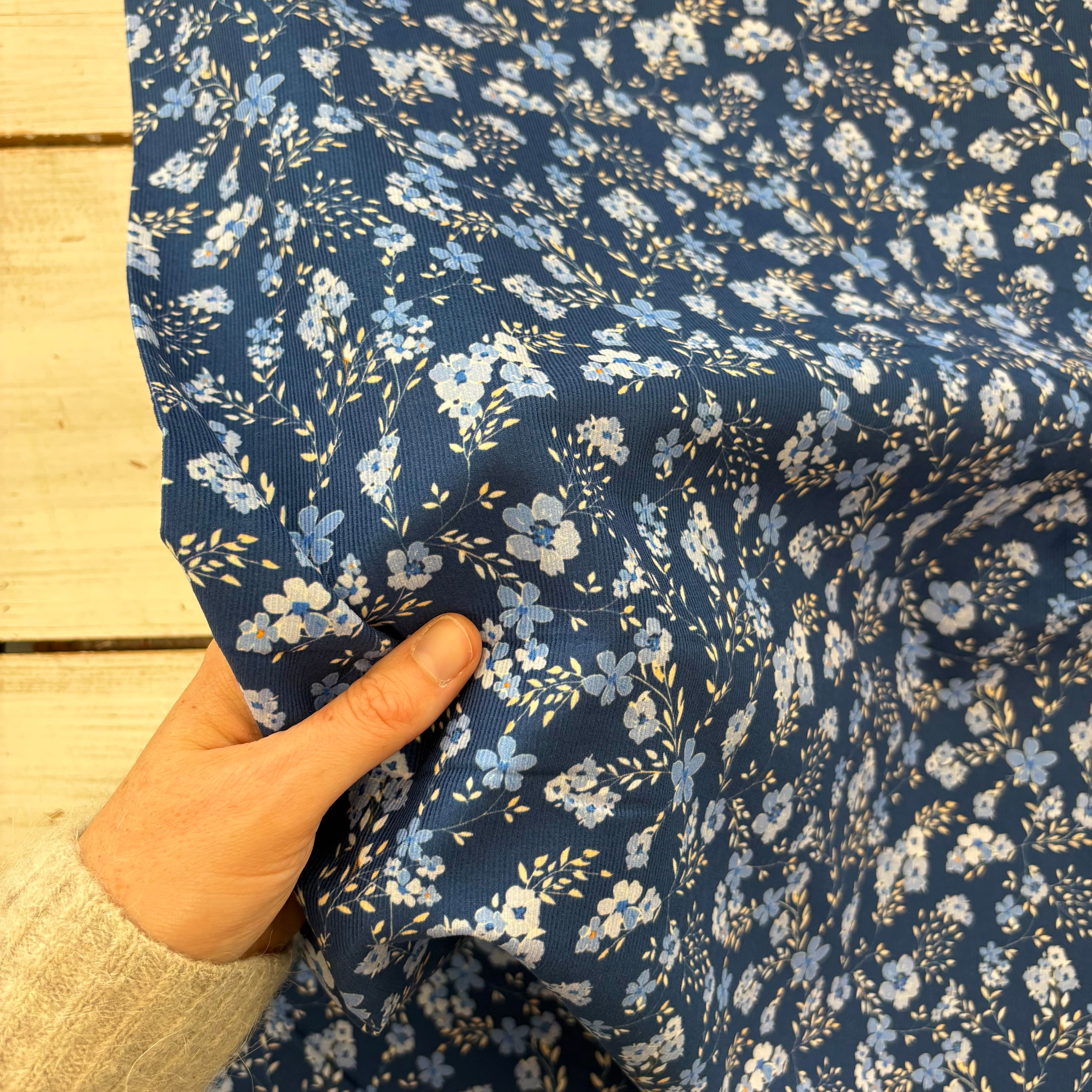 C858 Dainty Trailing Floral Needlecord Blue Fabric Scale
