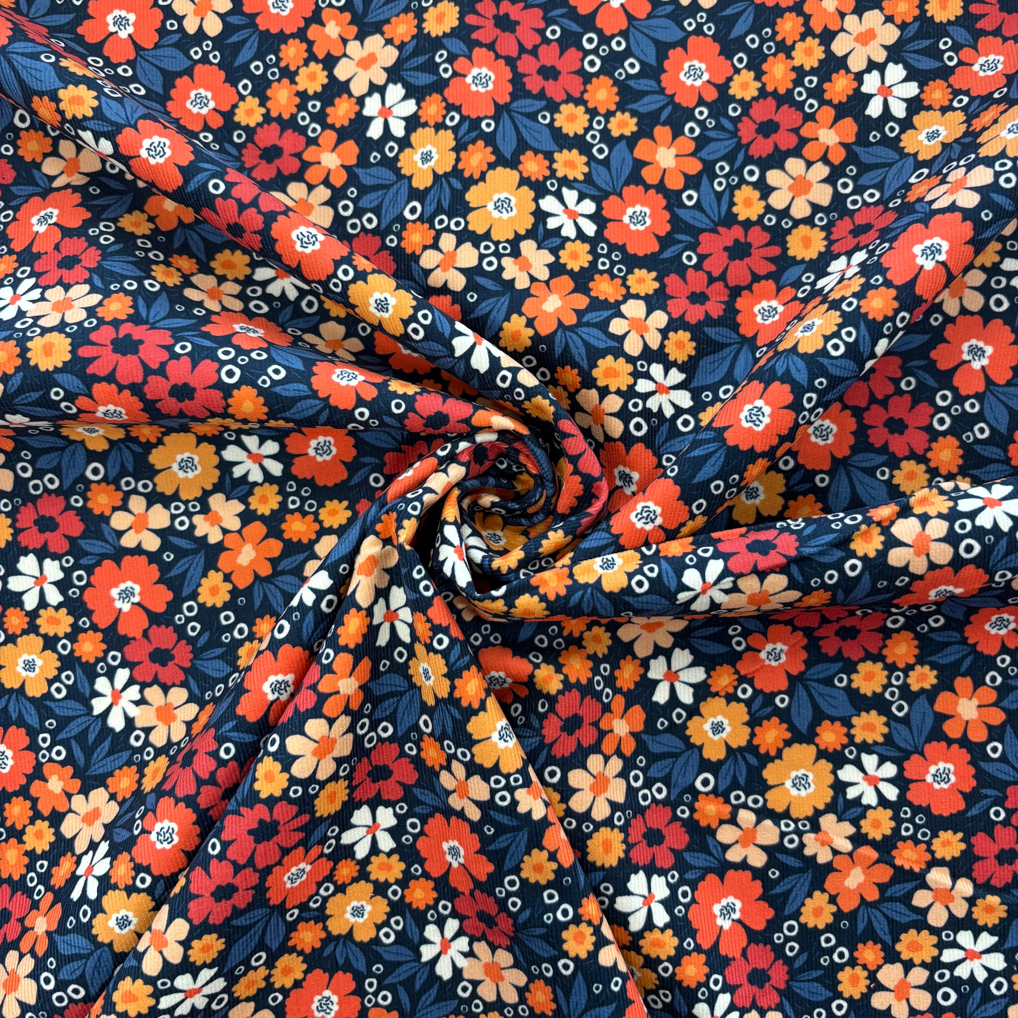C859 Flower Power Needlecord Navy Coral Fabric Gathered