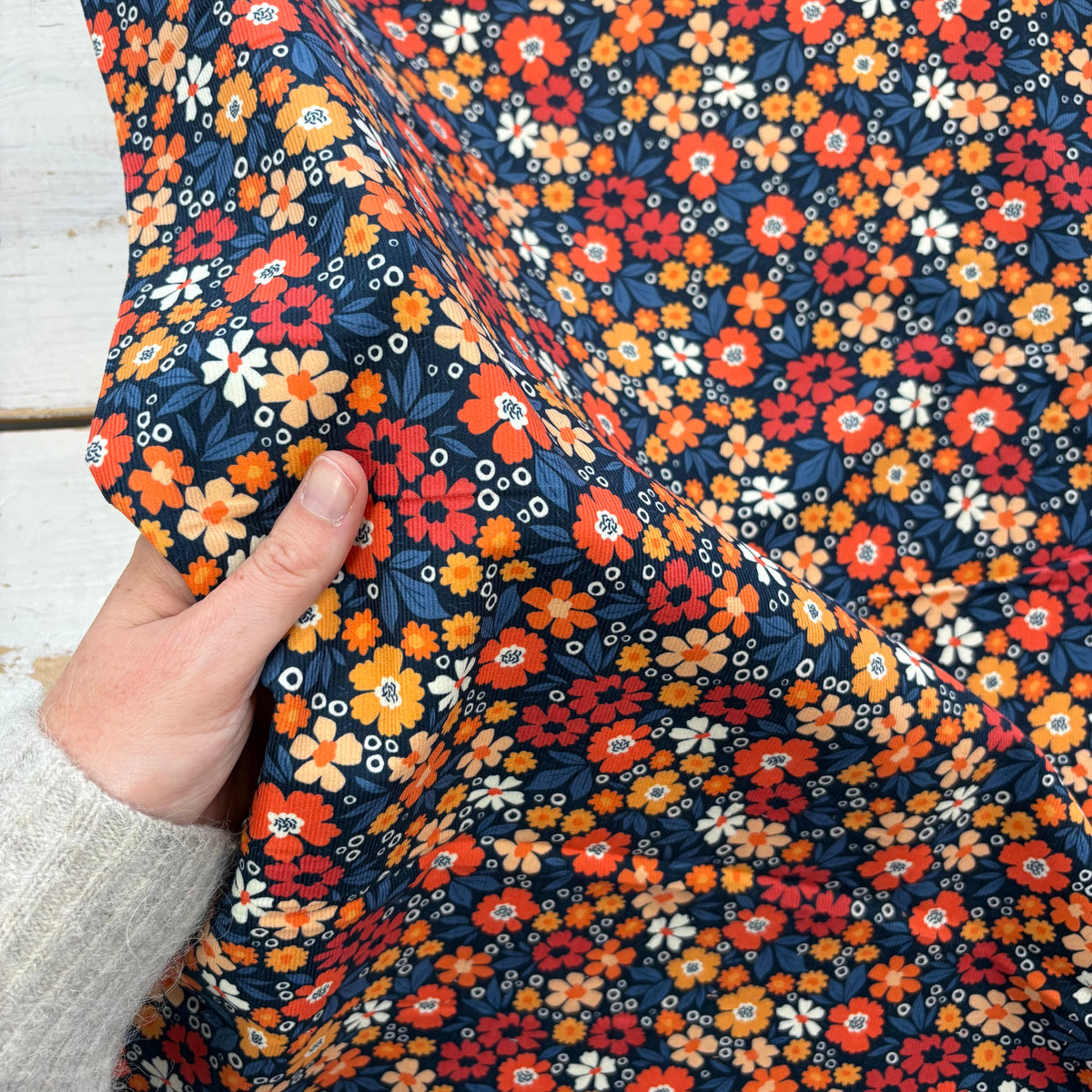 C859 Flower Power Needlecord Navy Coral Fabric Scale