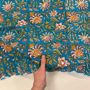 Celebration Floral Block Print Turquoise light weight cotton fabric Tex Ex 3045 with hand for scale