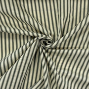 Classic forest green cotton ticking fabric with traditional stripes twisted to show drape, ideal for cushions, tablecloths, table runners, lampshades, home furnishings and DIY craft projects. Timeless striped cotton fabric for contemporary and country style interiors.