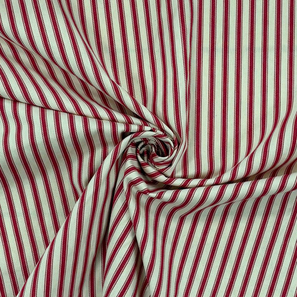 Classic red cotton ticking fabric with traditional twisted to show drape, ideal for cushions, tablecloths, table runners, lampshades, home furnishings and DIY craft projects. 