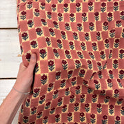 Floral Chess Block Print Cotton Fabric, with hand for scale, lightweight soft cotton with a traditional handcrafted Indian floral pattern
