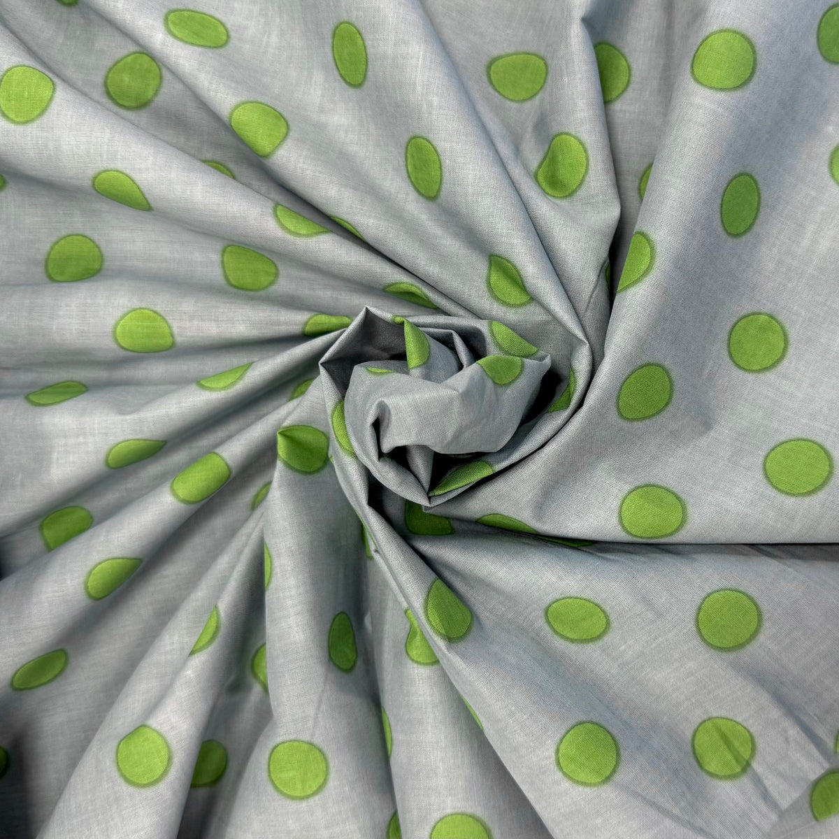 Mineral Blue Spotty Indian Print Cotton Fabric gathered, lightweight 100gsm printed cotton for dressmaking, handmade gifts, crafts and soft furnishings, handcrafted using traditional Indian printing techniques.