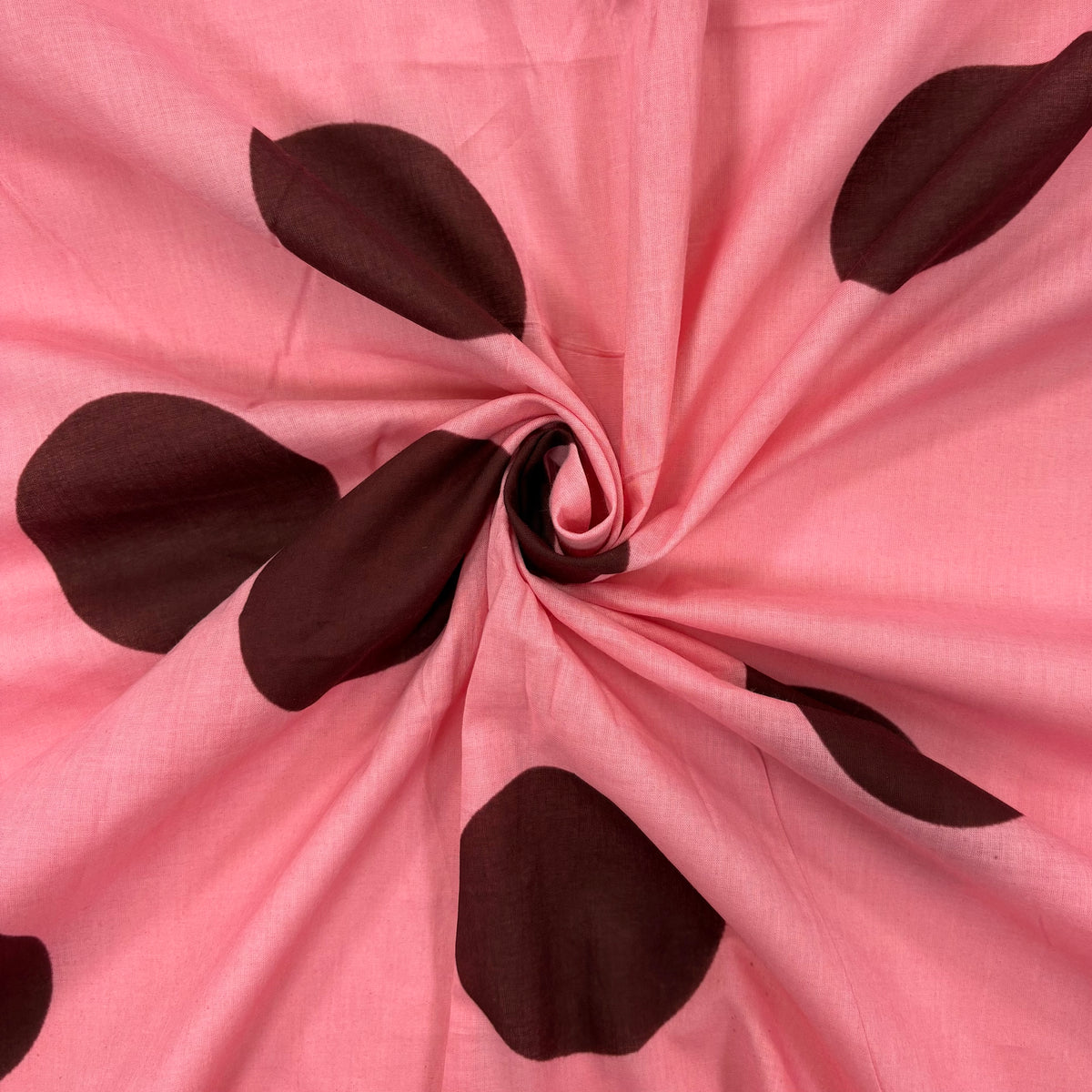 Pink Giant Spot Indian Print Cotton Fabric gathered, lightweight 100gsm printed cotton for dressmaking, handmade gifts, crafts and soft furnishings, handcrafted using traditional Indian printing techniques.