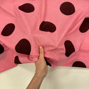 Pink Giant Spot Indian Print Cotton Fabric with hand for scale, lightweight 100gsm printed cotton for dressmaking, handmade gifts, crafts and soft furnishings, handcrafted using traditional Indian printing techniques.