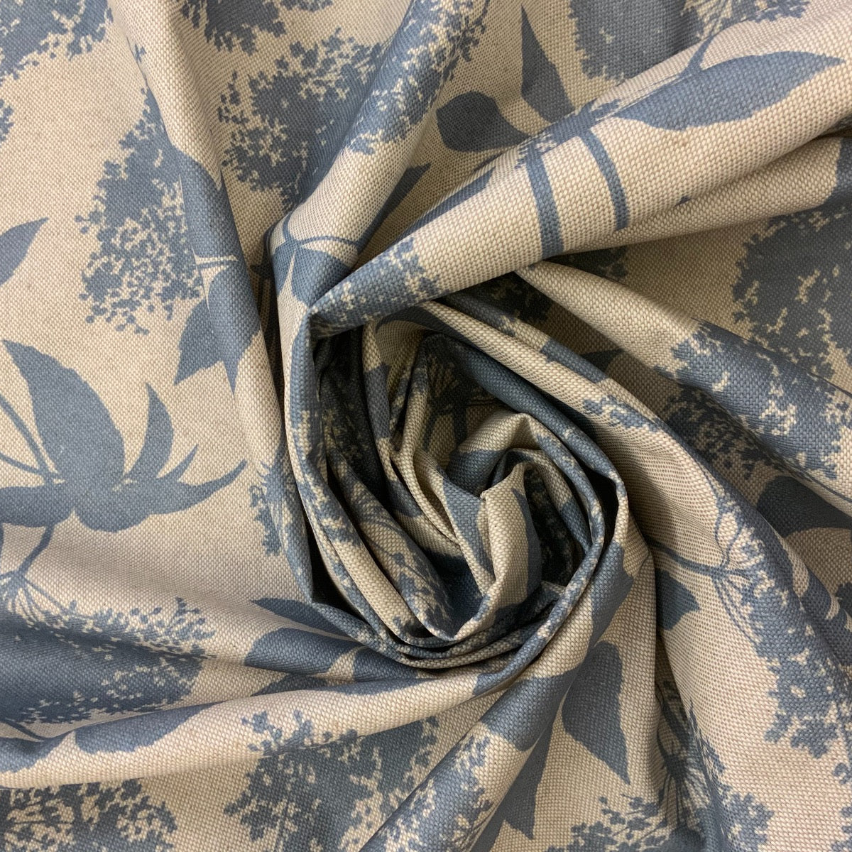 S188 Elderflower Oilcloth Natural Blue Fabric Close Up Fabric Gathered