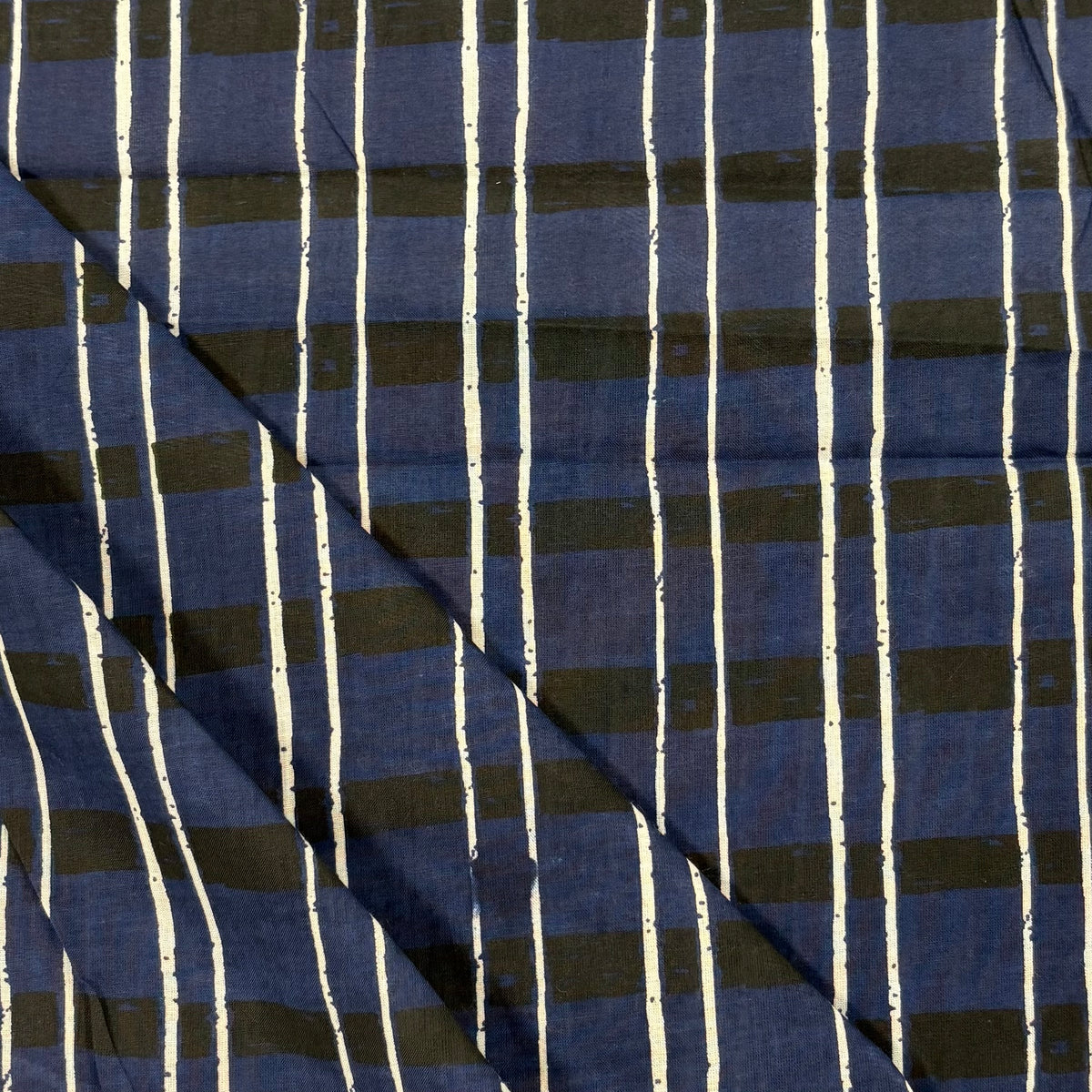 Sketch Tartan Block Print Cotton Fabric, folded, lightweight soft cotton with a traditional handcrafted Indian tartan check pattern.