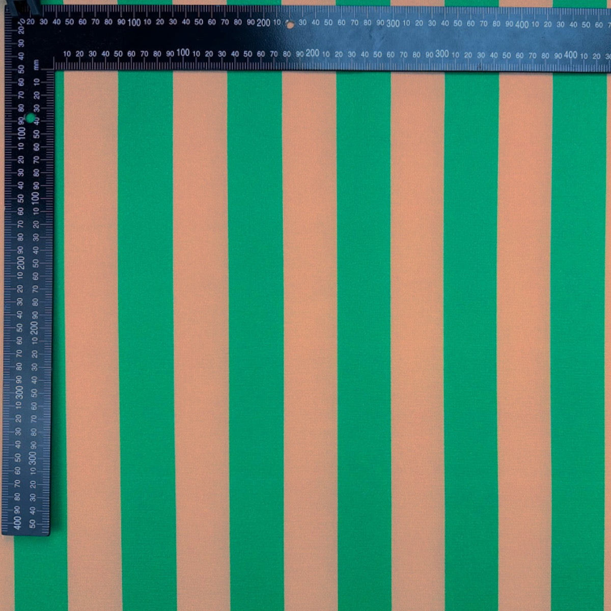 T544 Bold Candy Stripe Green fabric with ruler for scale