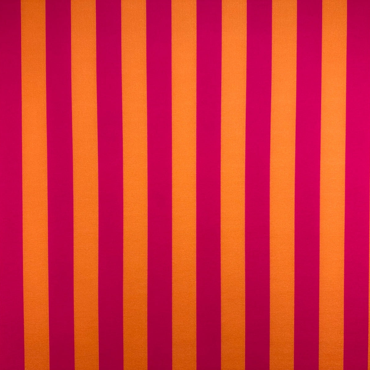 T545 Bold Candy Stripe Pink Striped fabric with alternating red and orange vertical stripes
