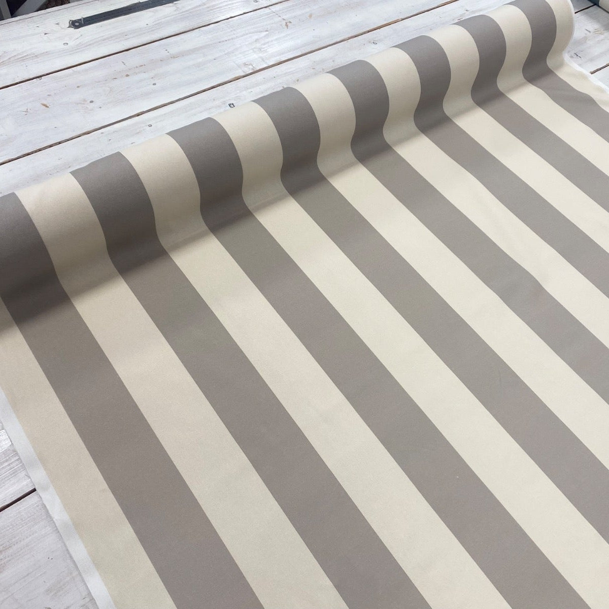The Bold Stripe Mushroom Taupe Fabric Roll On Table