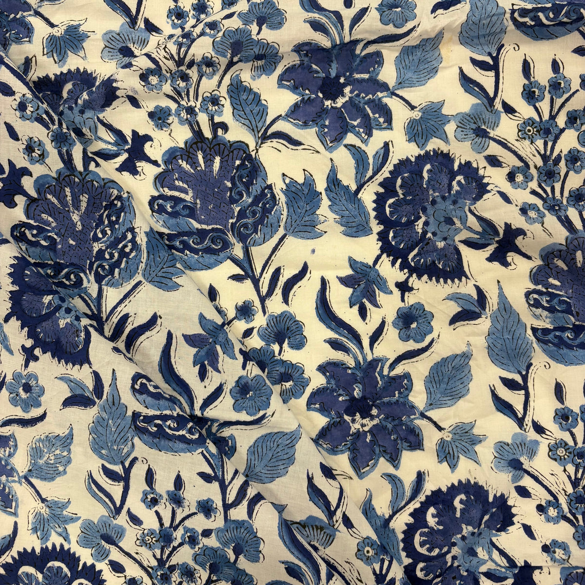 Trailing blooms Floral block Print Cotton Fabric, folded, lightweight, soft cotton fabric featuring a traditional handcrafted Indian block print floral pattern, perfect for dressmaking, quilting, crafts, handmade gifts and light home décor projects.