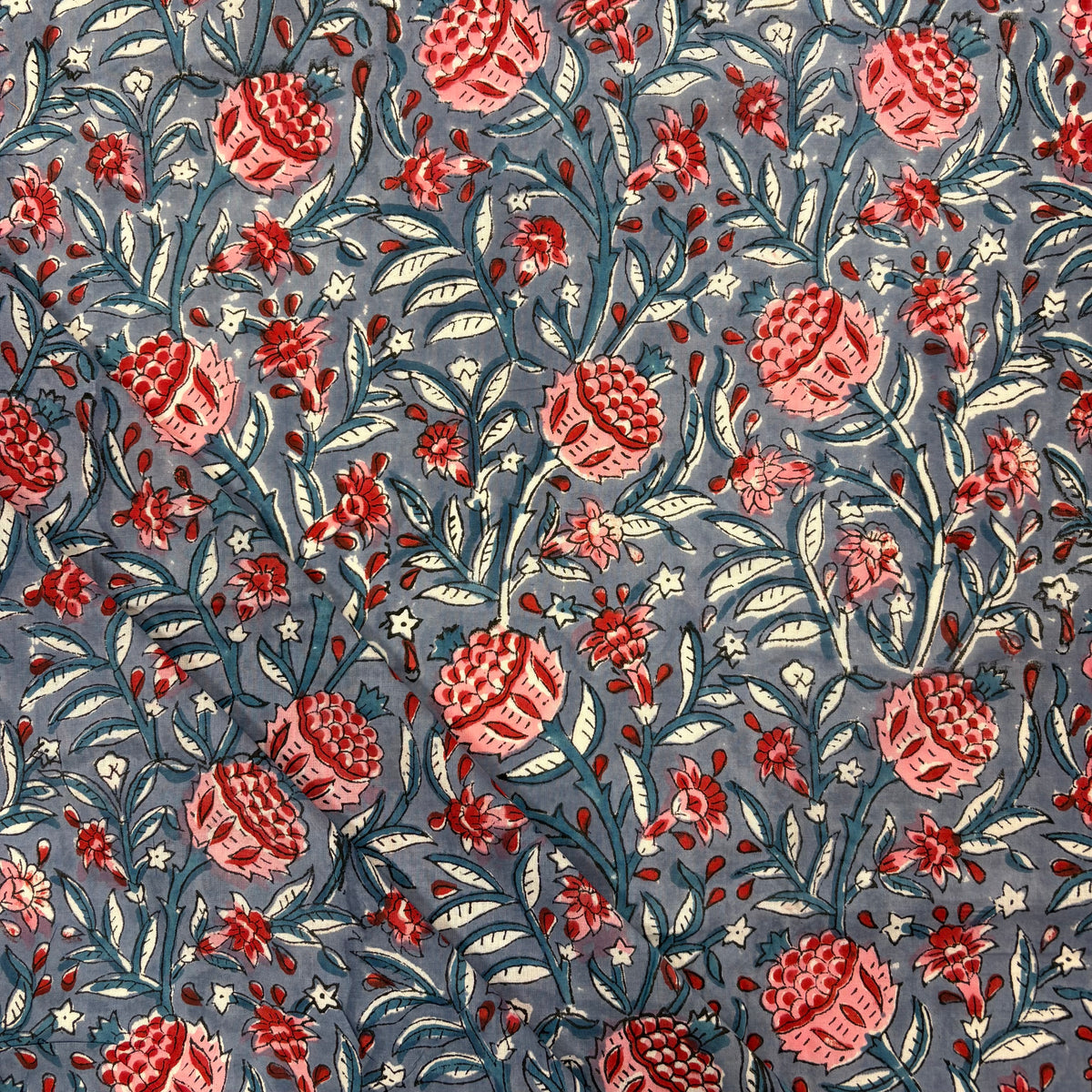 Winter Floral Indian Print Cotton Fabric, folded, lightweight, soft cotton fabric featuring a traditional handcrafted Indian block print floral pattern, perfect for dressmaking, quilting, crafts, handmade gifts and light home décor projects.