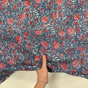 Winter Floral Indian Print Cotton Fabric, with hand for scale, lightweight, soft cotton fabric featuring a traditional handcrafted Indian block print floral pattern, perfect for dressmaking, quilting, crafts, handmade gifts and light home décor projects.