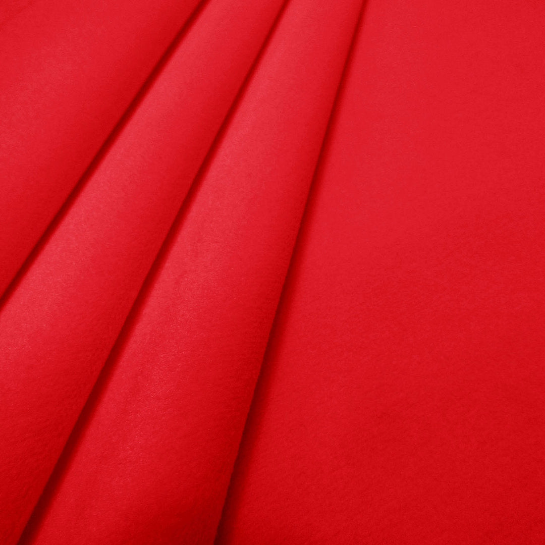 Close-up of red velvet upholstery and curtain fabric