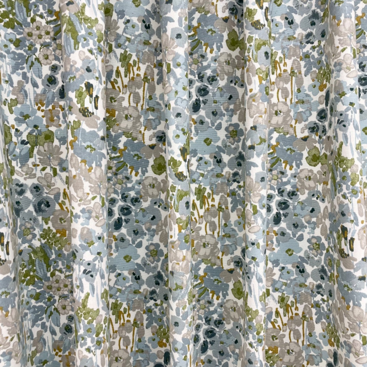 Patterned fabric with flowers in gray, green, and beige.