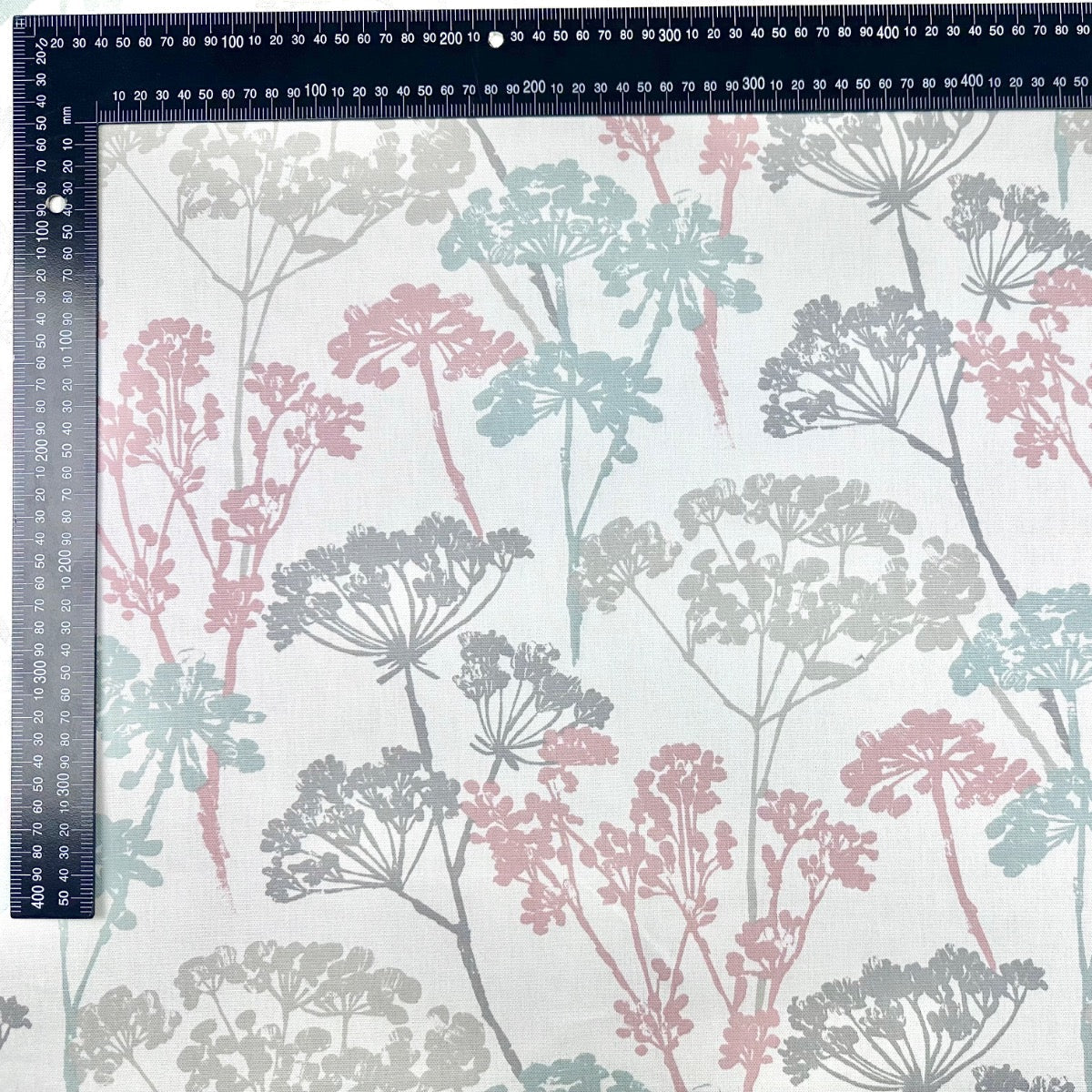 Clarke & Clarke floral cotton curtain fabric in soft pink and pastel shades.