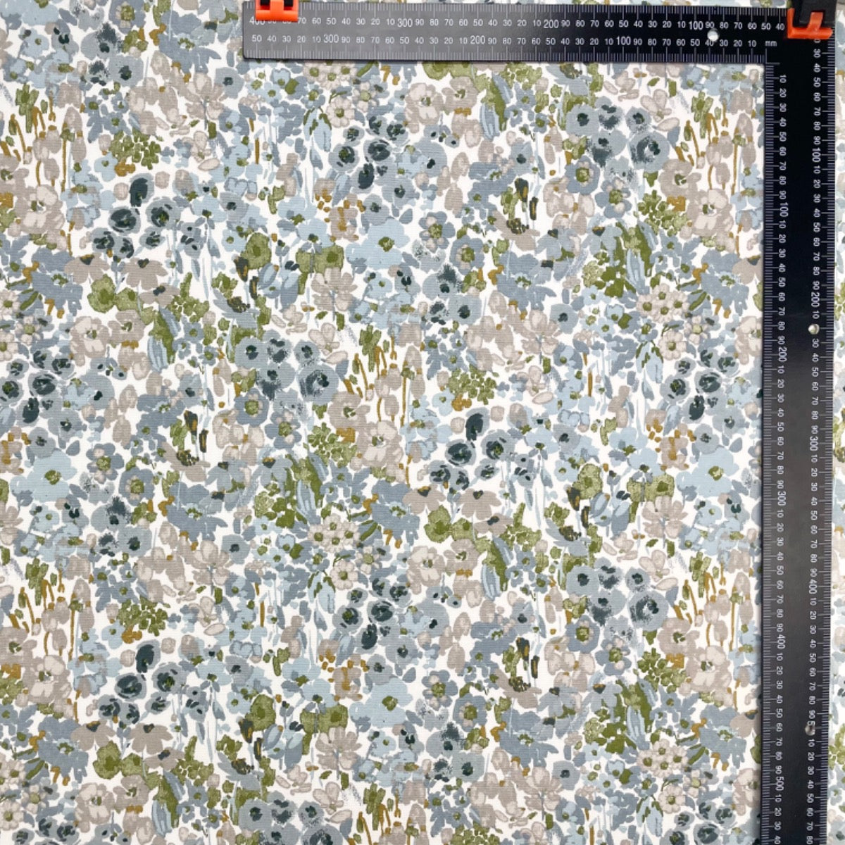 Floral patterned fabric with a ruler at the top right corner