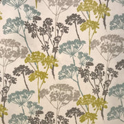 Floral patterned fabric with green, brown, and blue colors on a white background