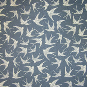 Cotton curtain fabric with coastal bird print on navy blue background. 